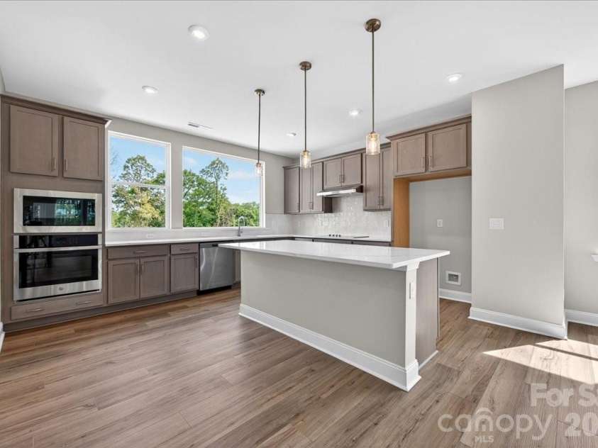 7921 Cedarsmith Court, Charlotte, NC 28217.  MLS# CAR4367826, YatesRealty ID 22649. Gourmet kitchen with large windows for ample natural light