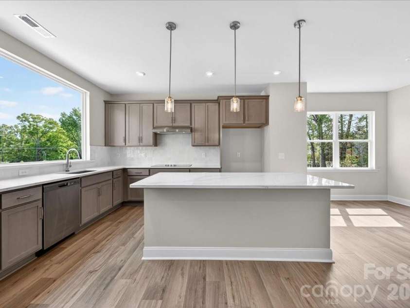 7921 Cedarsmith Court, Charlotte, NC 28217.  MLS# CAR4367826, YatesRealty ID 22649. Gourmet kitchen with large windows for ample natural light