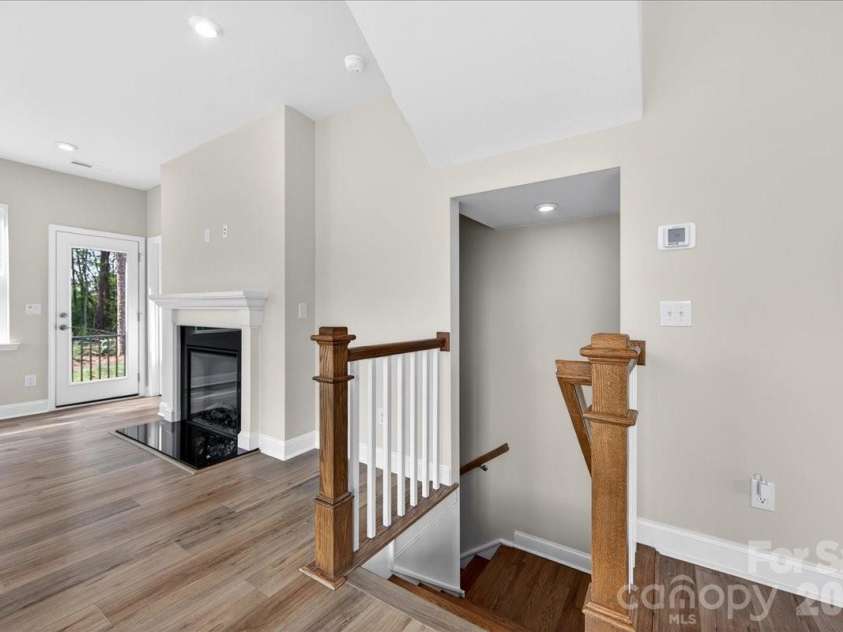 7921 Cedarsmith Court, Charlotte, NC 28217.  MLS# CAR4367826, YatesRealty ID 22649. Second floor landing and open rail staircase