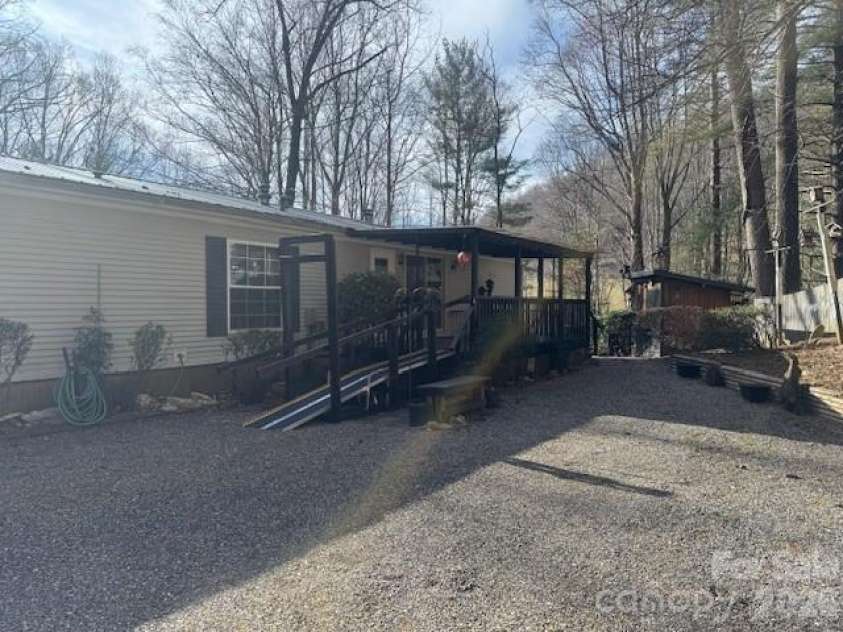 1372 Lickskillet Road, Burnsville, NC 28714.  MLS# CAR4333089, YatesRealty ID 2265. Covered Back Porch