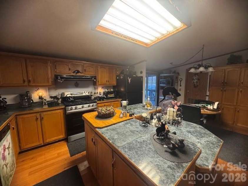 1372 Lickskillet Road, Burnsville, NC 28714.  MLS# CAR4333089, YatesRealty ID 2265. Kitchen with Island