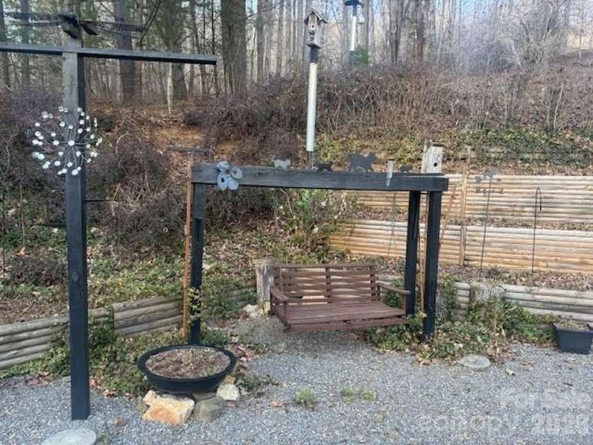 1372 Lickskillet Road, Burnsville, NC 28714.  MLS# CAR4333089, YatesRealty ID 2265. Porch Swing behind the house