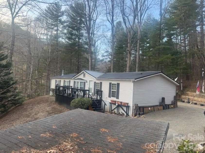 1372 Lickskillet Road, Burnsville, NC 28714.  MLS# CAR4333089, YatesRealty ID 2265. Side view of house