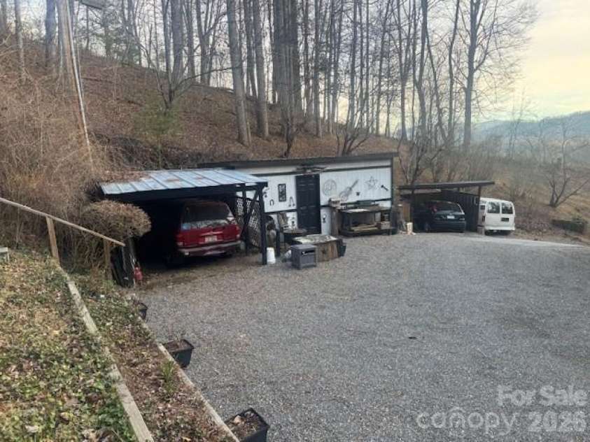1372 Lickskillet Road, Burnsville, NC 28714.  MLS# CAR4333089, YatesRealty ID 2265. Utility Shed with covered parking space.