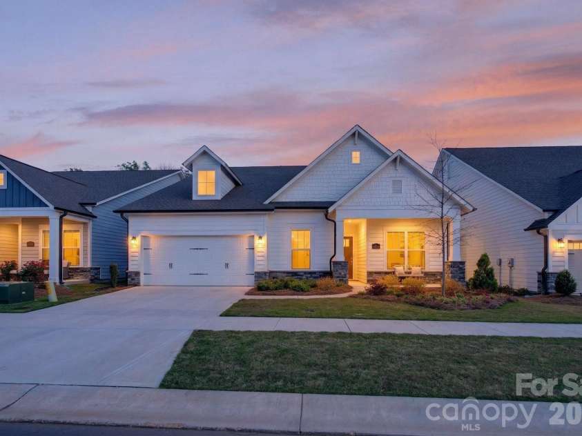 1405 Encore Lane, Waxhaw, NC 28173.  MLS# CAR4366207, YatesRealty ID 22650. Evening Front Exterior