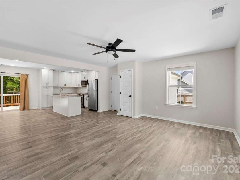 529 Central Avenue, Locust, NC 28097.  MLS# CAR4274462, YatesRealty ID 22653. Open living space spanning from the front to the rear of the home