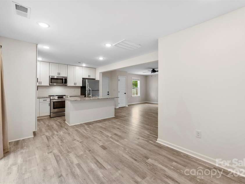 529 Central Avenue, Locust, NC 28097.  MLS# CAR4274462, YatesRealty ID 22653. Open living space spanning from the front to the rear of the home with a dedicated dining space