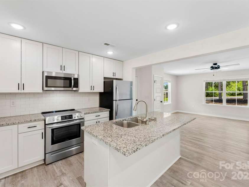 529 Central Avenue, Locust, NC 28097.  MLS# CAR4274462, YatesRealty ID 22653. Open, modern kitchen - perfect for entertaining guests