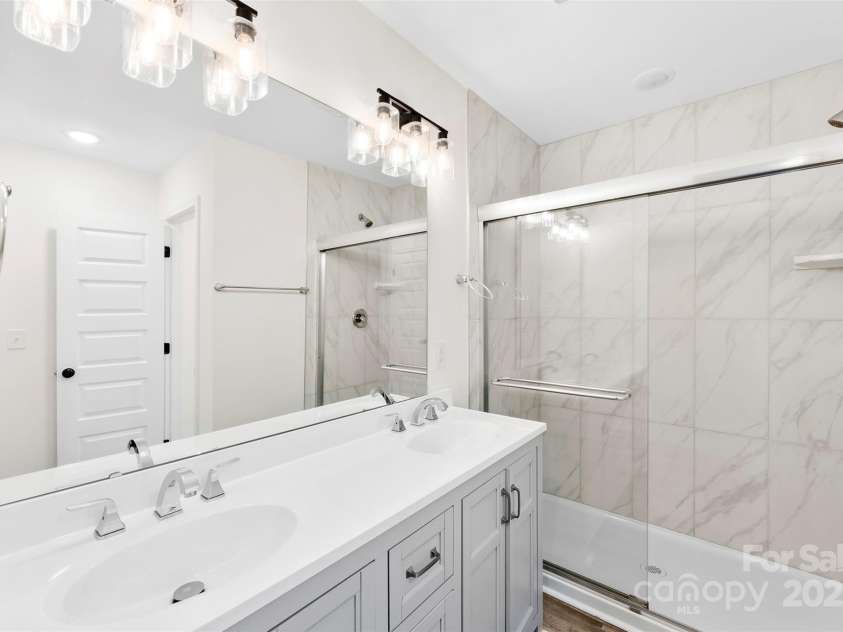 529 Central Avenue, Locust, NC 28097.  MLS# CAR4274462, YatesRealty ID 22653. Primary bedroom ensuite bathroom with dual vanity