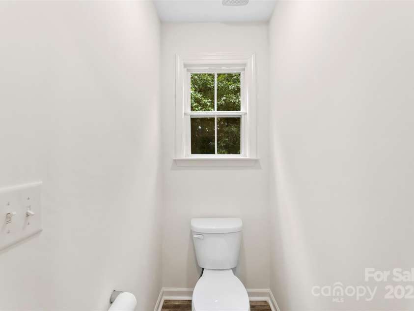 529 Central Avenue, Locust, NC 28097.  MLS# CAR4274462, YatesRealty ID 22653. Primary bedroom ensuite bathroom with dual vanity and separate water closet