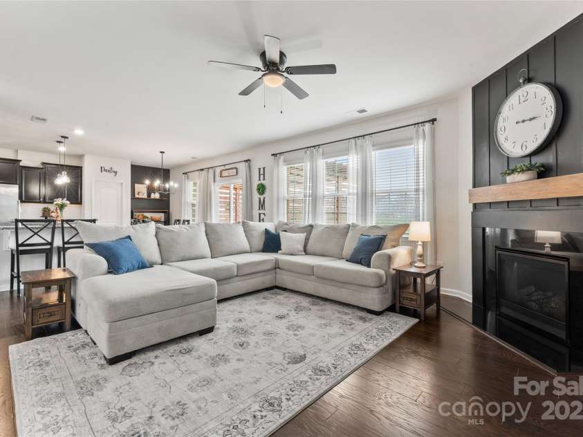17231 Rider Wood Lane, Charlotte, NC 28278.  MLS# CAR4269861, YatesRealty ID 22676. Family room with statement wall and gas fireplace