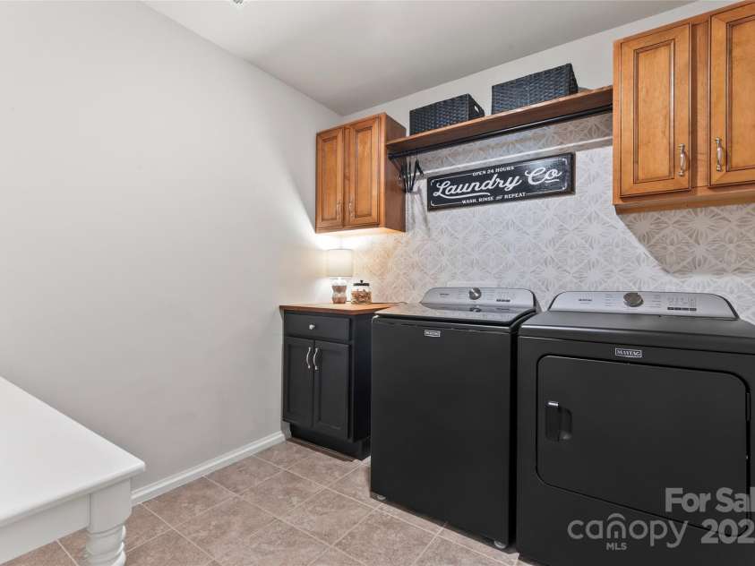 17231 Rider Wood Lane, Charlotte, NC 28278.  MLS# CAR4269861, YatesRealty ID 22676. Laundry room with tons of storage and statement wall