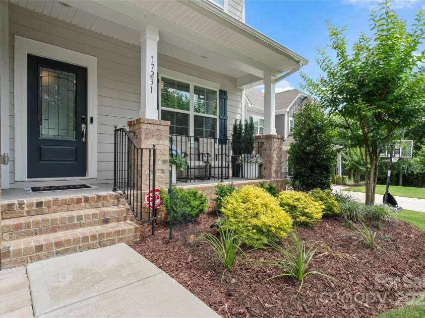17231 Rider Wood Lane, Charlotte, NC 28278.  MLS# CAR4269861, YatesRealty ID 22676. Rocking Chair front porch!