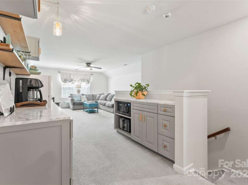 17231 Rider Wood Lane, Charlotte, NC 28278.  MLS# CAR4269861, YatesRealty ID 22676. Upstairs you'll find a 2nd living area or HUGE binus room, bedroom and bath