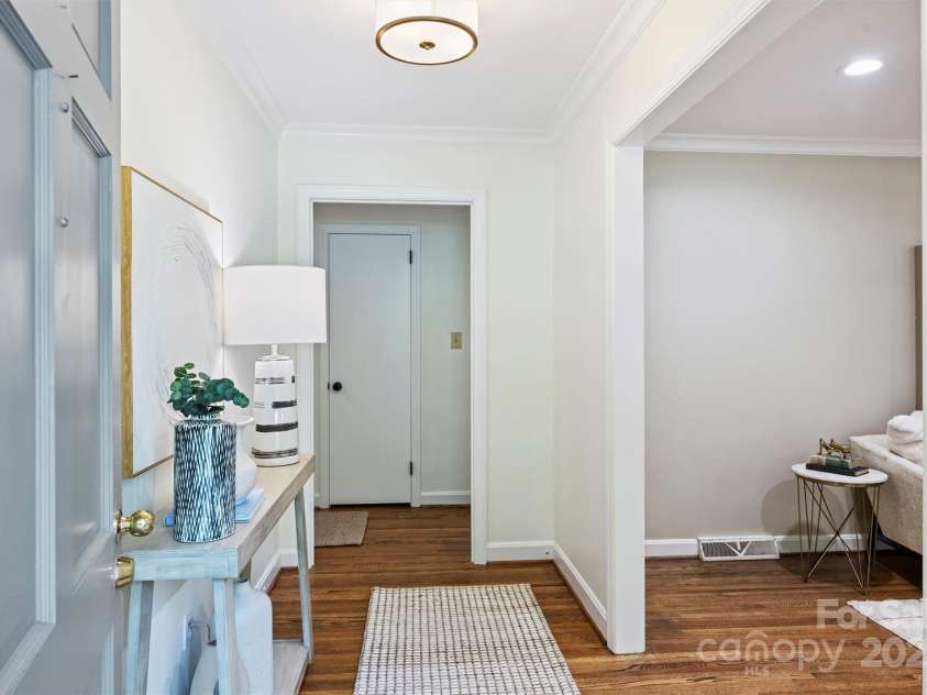 6150 Rocky Falls Road, Charlotte, NC 28211.  MLS# CAR4270630, YatesRealty ID 22677. As you step inside, you’ll first notice beautiful hardwood floors and fresh paint throughout the main level of the home.