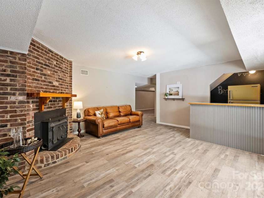 6150 Rocky Falls Road, Charlotte, NC 28211.  MLS# CAR4270630, YatesRealty ID 22677. Basement den features fun bar/hangout area - think play kitchen for kids, man cave, or fun entertaining space!