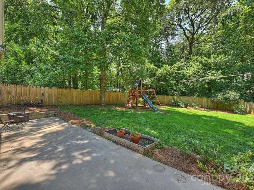 6150 Rocky Falls Road, Charlotte, NC 28211.  MLS# CAR4270630, YatesRealty ID 22677. Large patio looking onto large, flat, fully-fenced backyard!