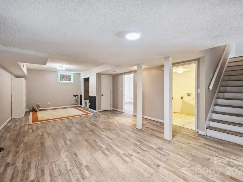 6150 Rocky Falls Road, Charlotte, NC 28211.  MLS# CAR4270630, YatesRealty ID 22677. The basement offers an oversized playroom or bonus room area.