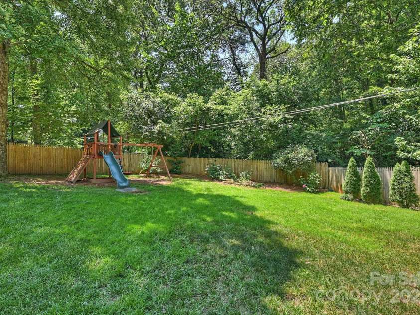 6150 Rocky Falls Road, Charlotte, NC 28211.  MLS# CAR4270630, YatesRealty ID 22677. This home is nestled in the beautiful tree-lined streets of Stonehaven where you’ll find two neighborhood swim & racquet clubs!