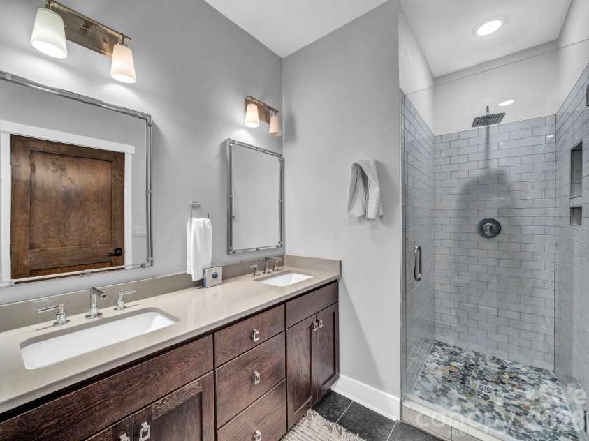 198 Ramblestone Terrace, Boone, NC 28607.  MLS# CAR4310006, YatesRealty ID 2268. Primary bathroom with double venity and tile shower