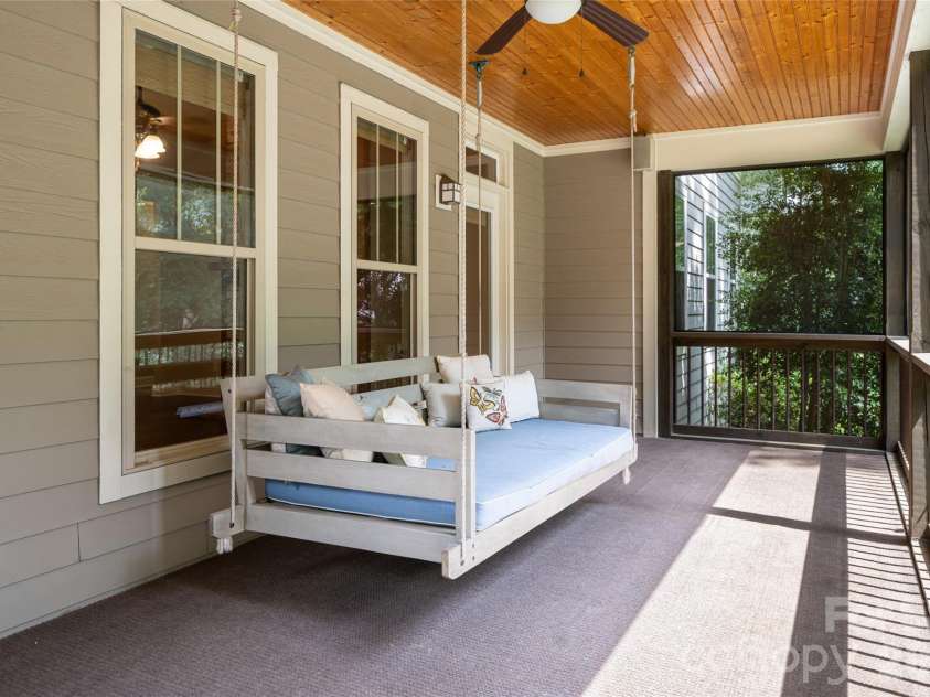 22 Sparkle Dun Drive, Biltmore Lake, NC 28715.  MLS# CAR4417857, YatesRealty ID 22681. The large screened-in back porch features