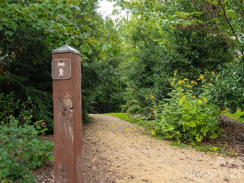 22 Sparkle Dun Drive, Biltmore Lake, NC 28715.  MLS# CAR4417857, YatesRealty ID 22681. Trail Access is located one lot away from 22 Sparkle Dun