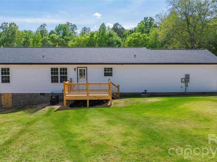 1602 Friendship Ledford Road, Winston Salem, NC 27107.  MLS# CAR4378150, YatesRealty ID 22684. Back deck. Virtual grass