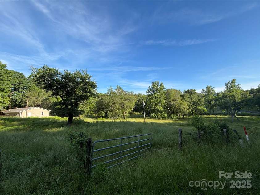 2130 Vashti Road, Taylorsville, NC 28681.  MLS# CAR4263613, YatesRealty ID 22689. Pasture and back of home.