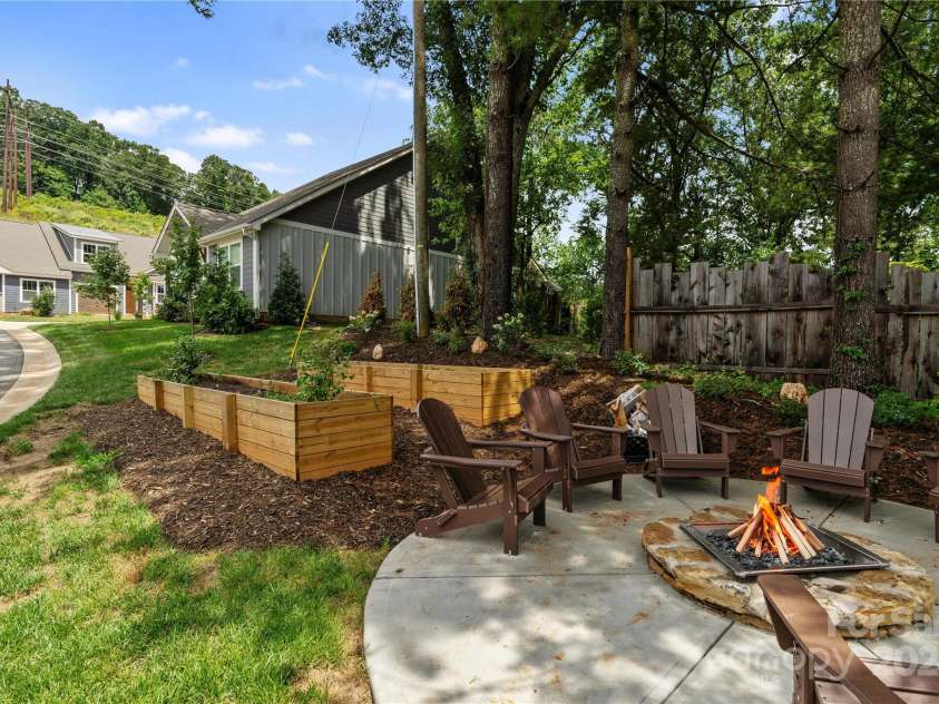 22 Heartleaf Circle, Arden, NC 28704.  MLS# CAR4166321, YatesRealty ID 2269. Community Garden Boxes & Firepit