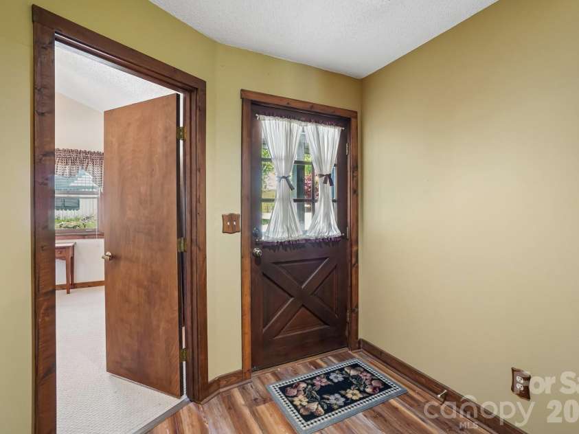 302 Eagles Nest Court, Mars Hill, NC 28754.  MLS# CAR4369969, YatesRealty ID 22693. Enter This Amazing Villa