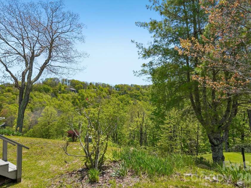 302 Eagles Nest Court, Mars Hill, NC 28754.  MLS# CAR4369969, YatesRealty ID 22693. Southern Exposure Villa w/Golf Course views