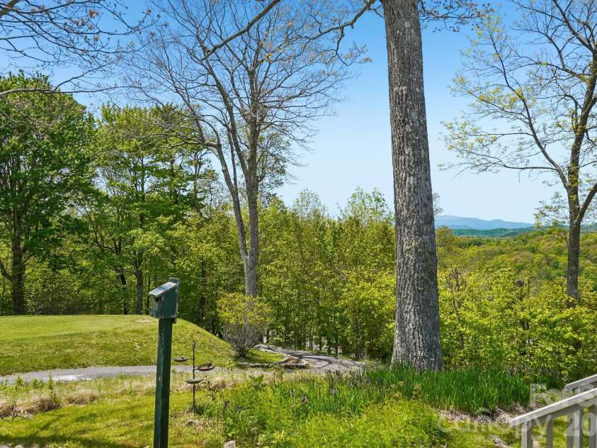302 Eagles Nest Court, Mars Hill, NC 28754.  MLS# CAR4369969, YatesRealty ID 22693. Southern Exposure Villa w/Golf Course views