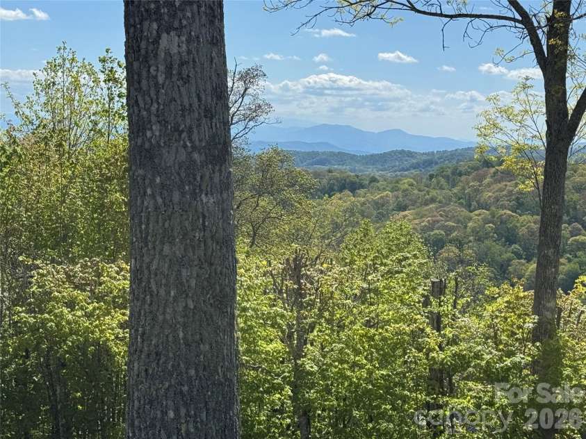 302 Eagles Nest Court, Mars Hill, NC 28754.  MLS# CAR4369969, YatesRealty ID 22693. Southern Exposure Villa w/Golf Course views