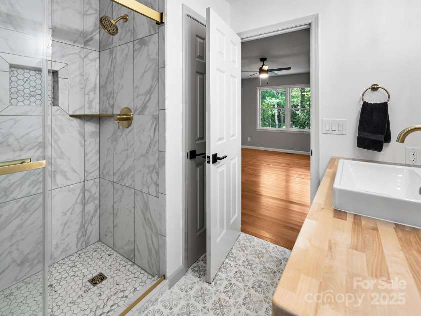210 Fernwood Drive, Hendersonville, NC 28791.  MLS# CAR4275112, YatesRealty ID 22697. Master Bath walk in Shower