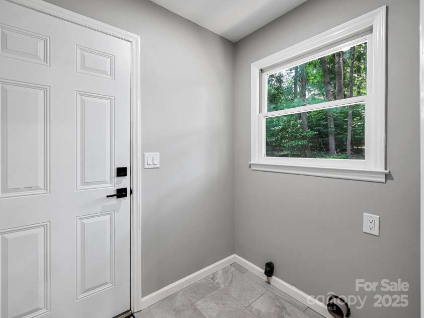 210 Fernwood Drive, Hendersonville, NC 28791.  MLS# CAR4275112, YatesRealty ID 22697. Mud Room ready for your washer/dryer