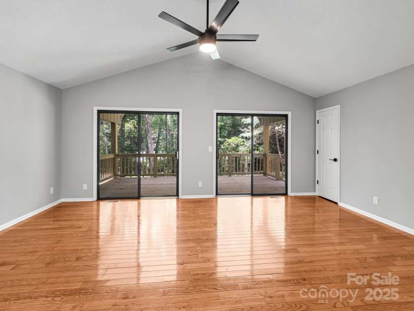210 Fernwood Drive, Hendersonville, NC 28791.  MLS# CAR4275112, YatesRealty ID 22697. Vaulted Great Room with Sliding Doors