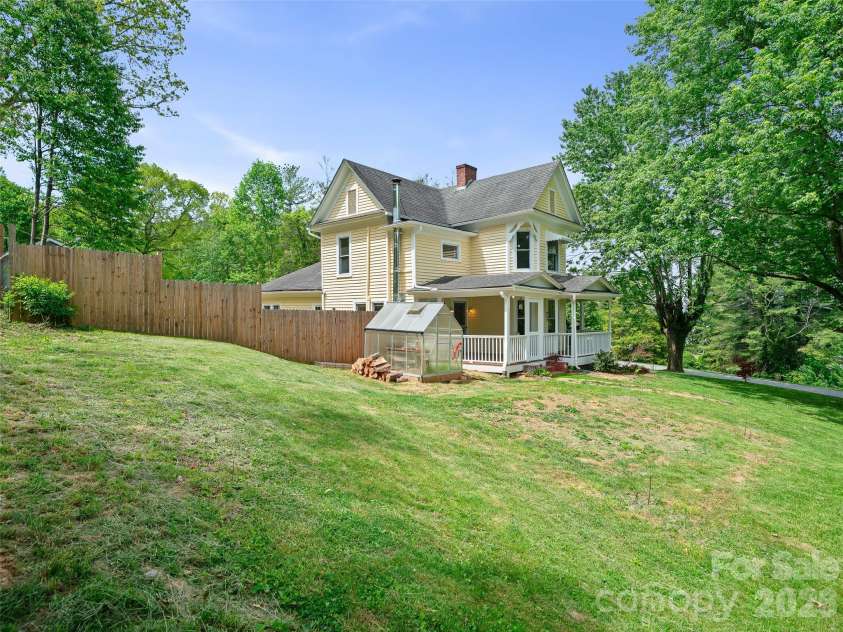 309 Hillside Drive, Burnsville, NC 28714.  MLS# CAR4361793, YatesRealty ID 22697. Side Yard