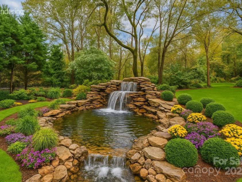501 River Oaks Lane, Charlotte, NC 28226.  MLS# CAR4192085, YatesRealty ID 22698. Envision a serene outdoor escape—this backyard concept showcases a beautifully integrated large pond, creating a tranquil focal point for relaxation and natural beauty. Ideal for entertaining or quiet reflection, it's 