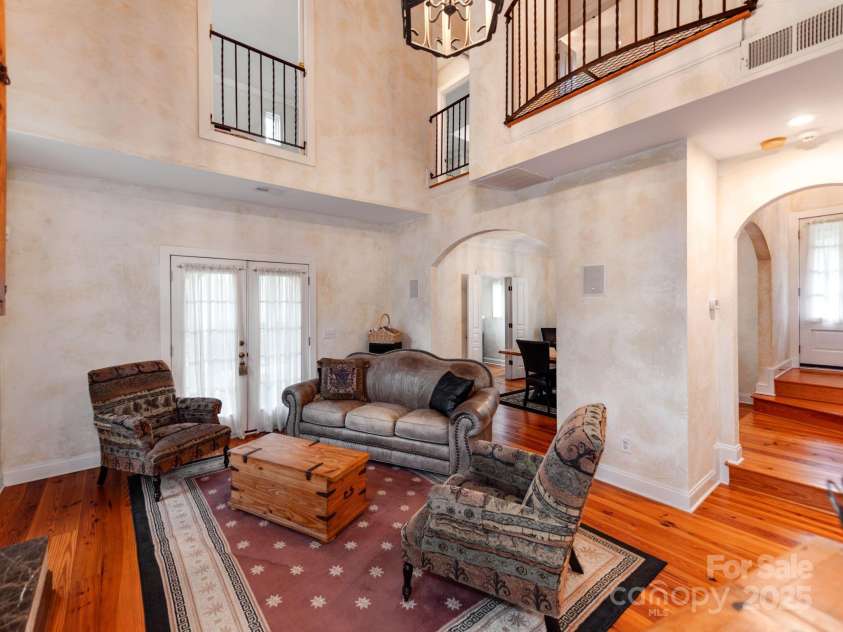 501 River Oaks Lane, Charlotte, NC 28226.  MLS# CAR4192085, YatesRealty ID 22698. The double French doors open to a charming outdoor patio, creating a seamless flow for effortless entertaining.