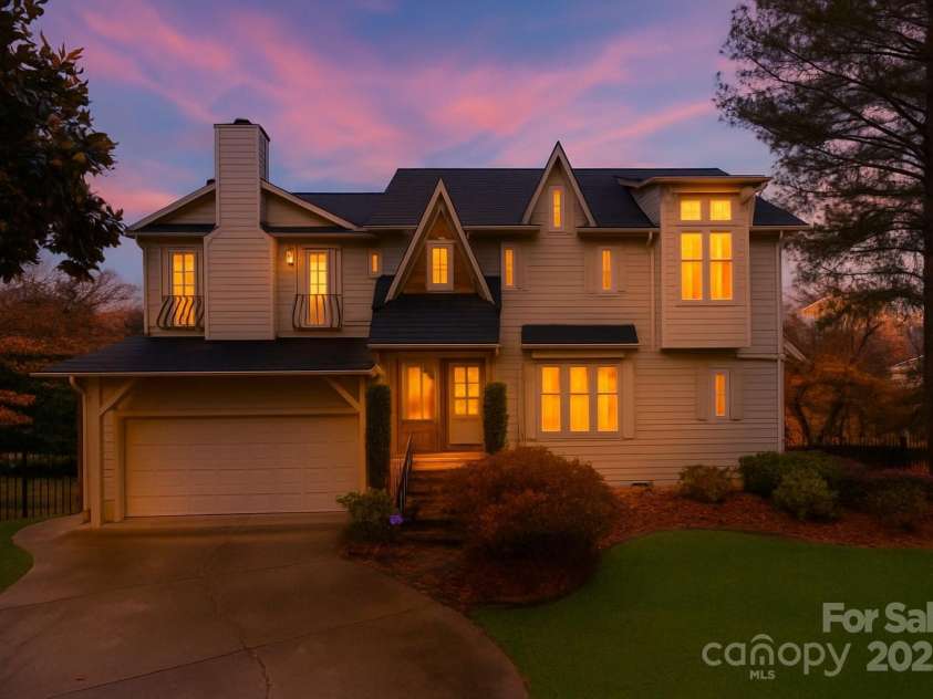 501 River Oaks Lane, Charlotte, NC 28226.  MLS# CAR4192085, YatesRealty ID 22698. Twilight photo of this captivating home.