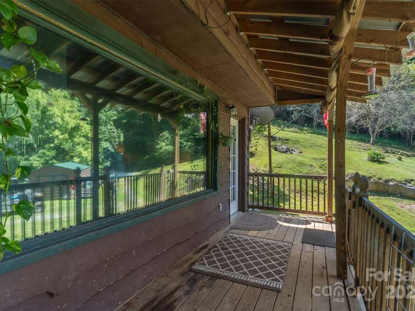 1145 Woolyshot Branch Road, Hot Springs, NC 28743.  MLS# CAR4295648, YatesRealty ID 227. Covered front porch. 