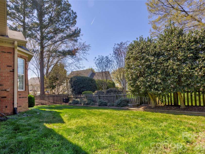 580 Gatsby Place, Concord, NC 28027.  MLS# CAR4359128, YatesRealty ID 22700. Side yard
