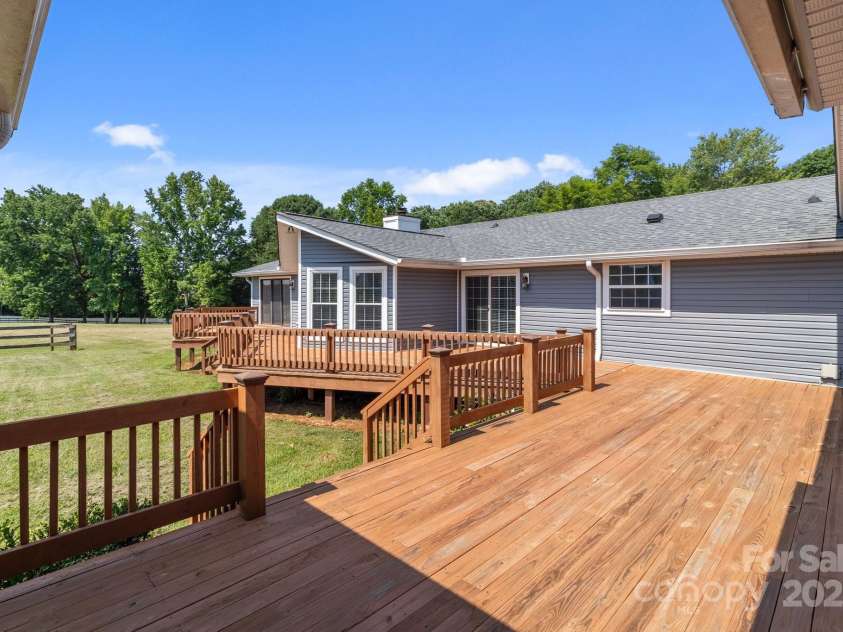 15020 Ranson Road, Huntersville, NC 28078.  MLS# CAR4266705, YatesRealty ID 22703. Full wrap around deck in the back