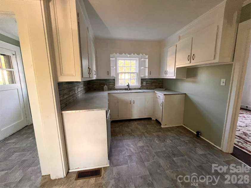 704 Mcadenville Road, Lowell, NC 28098.  MLS# CAR4351036, YatesRealty ID 2271. 