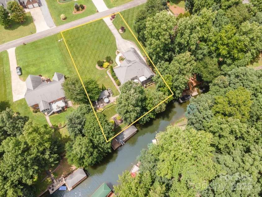 145 Waterwood Drive, Shelby, NC 28150.  MLS# CAR4267718, YatesRealty ID 22710. Sellers' grandkids LOVE swimming off the dock!
