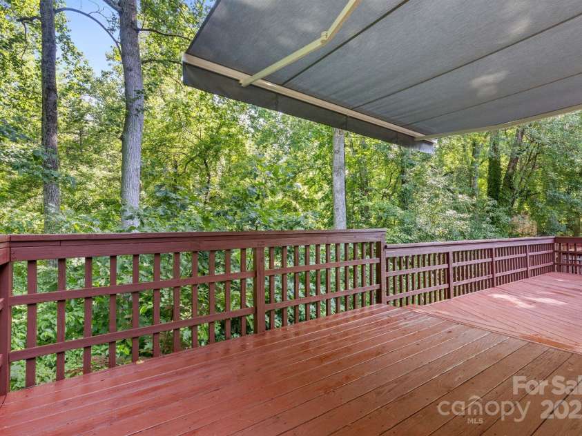 131 Canopy Court, Mooresville, NC 28115.  MLS# CAR4268984, YatesRealty ID 22713. Enjoy wooded views and shade from your private outdoor retreat.