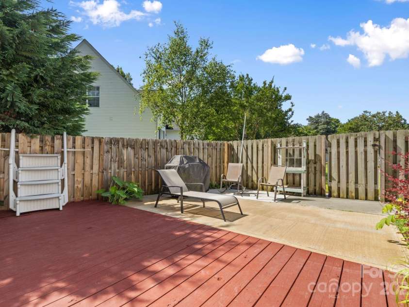 131 Canopy Court, Mooresville, NC 28115.  MLS# CAR4268984, YatesRealty ID 22713. Private patio nook perfect for morning coffee or sunset lounging.