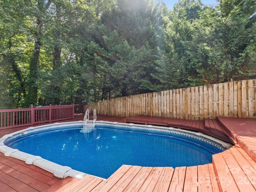 131 Canopy Court, Mooresville, NC 28115.  MLS# CAR4268984, YatesRealty ID 22713. Surrounded by trees for extra privacy and serenity.