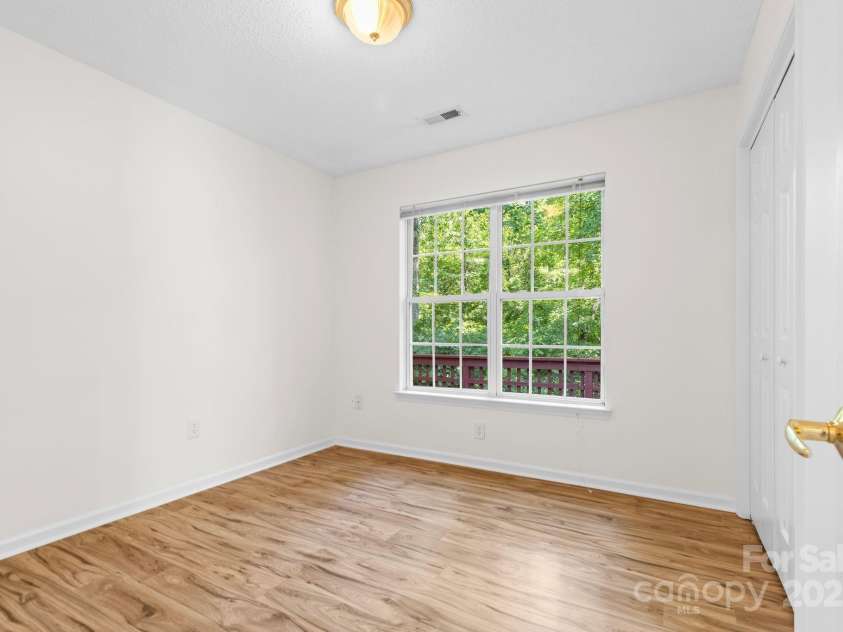 131 Canopy Court, Mooresville, NC 28115.  MLS# CAR4268984, YatesRealty ID 22713. Third bedroom overlooks the backyard—perfect for home office or guest room.