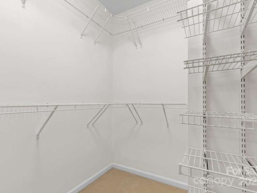131 Canopy Court, Mooresville, NC 28115.  MLS# CAR4268984, YatesRealty ID 22713. Walk-in closet in primary suite with custom shelving—plenty of storage!